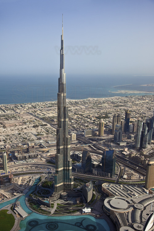 Aerial view over Burj, tallest tower in the world with 828 meters, and the new district 