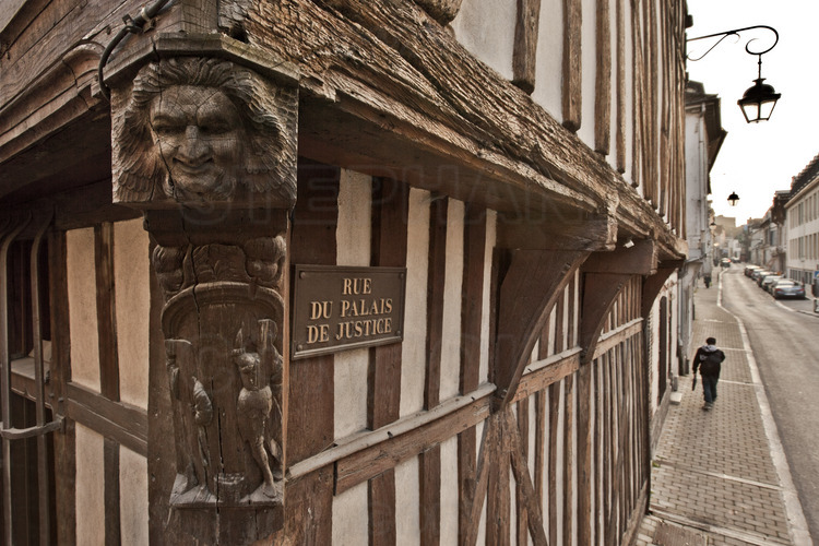 In the historical center, detail facade of medieval house at the crossroads of Palais de Justice street and alley of cats (ruelle des Chats). Elevation 4 meters.