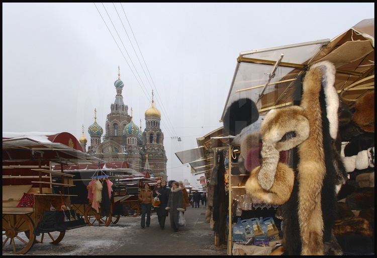 One of the city center's markets in Koniouchenaia Square.  In the 
background, the Church of our Savior on Spilled Blood.