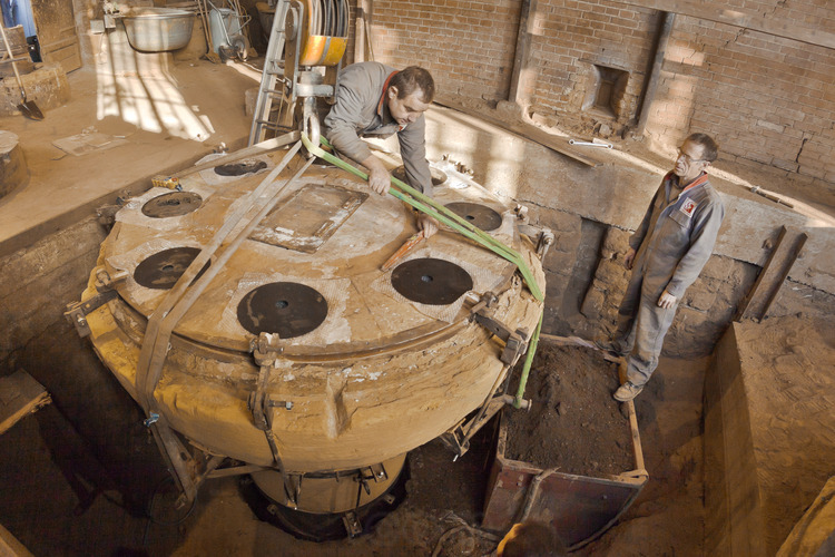 Villedieu les Poëles, Cornille Havard foundry, France. November 9, 2012. The mold of bell Gabriel (note A sharp, 4160 kg) is installed in the pit Diderot, where the metal will be poured a few days later.