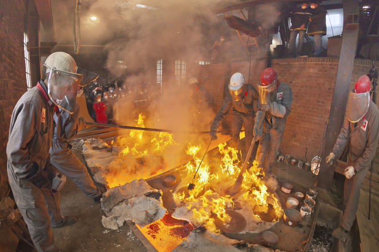 Villedieu les Poëles, Cornille Havard foundry, France. August 3, 2012, the day of casting bells. At noon, the casting itself begins. In an atmosphere of extreme concentration, several tons of metal are poured into molds. The operation, planned in the second, lasts barely 5 minutes.