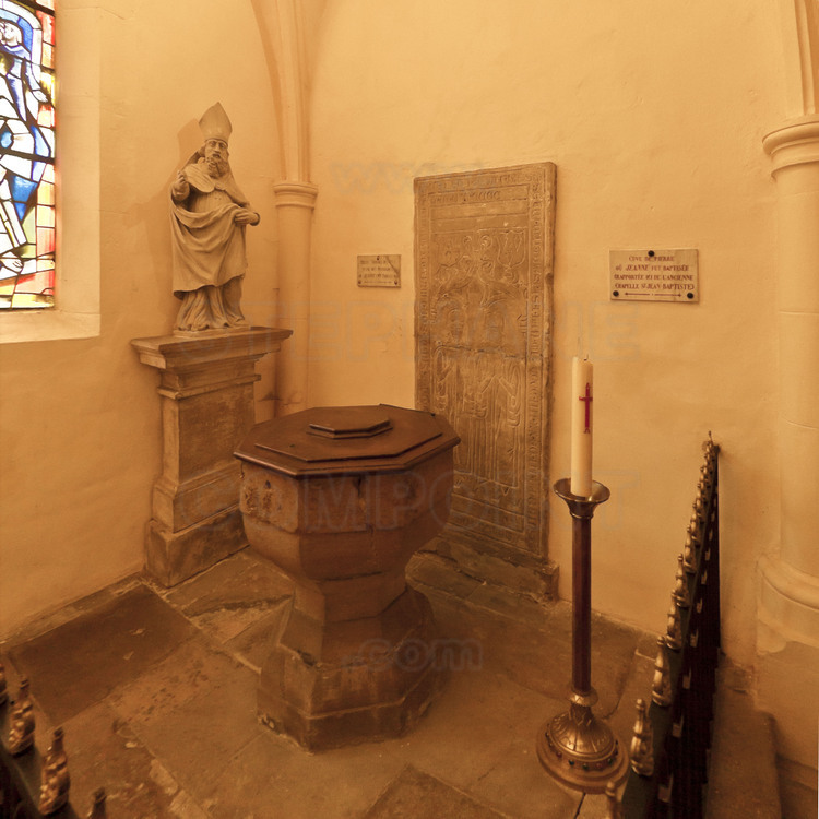 Domremy, where Joan of Arc was born January 6, 1412. Inside the parish church of St. Remy, the stone baptismal font of the fifteenth century, where she was baptized.