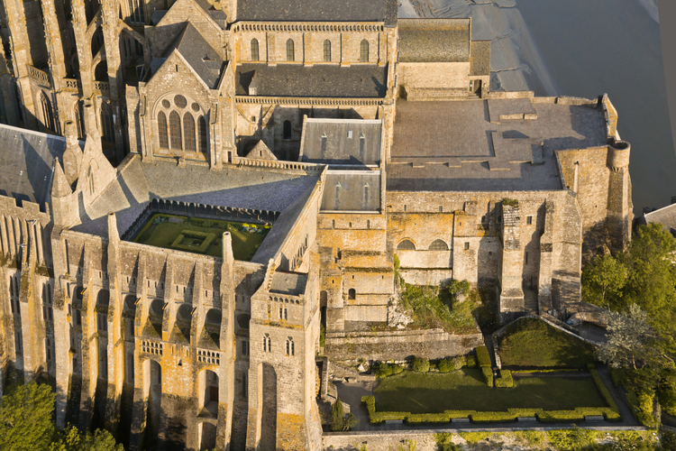Mont Saint Michel as seen from the north. In the foreground, the cloister (left) and the garden.