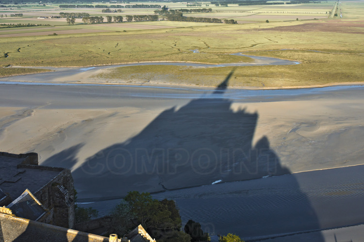 View from the east, the shadow of Mont Saint Michel on the salt marshes of the Bay.
