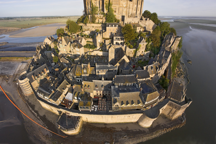 Mont Saint Michel as seen from the east. In the foreground, the ramparts and the village.