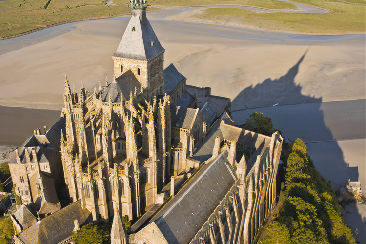 Mont Saint Michel as seen from the northeast. In the foreground, the chevet of the church.