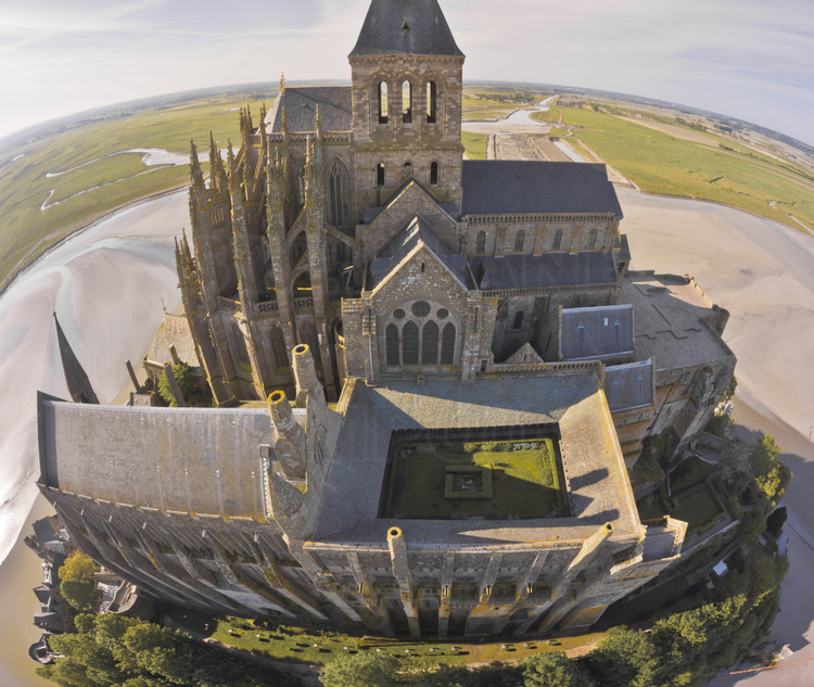Mont Saint Michel from the north. In the foreground, the refectory of Wonder (left) and the cloister (center).