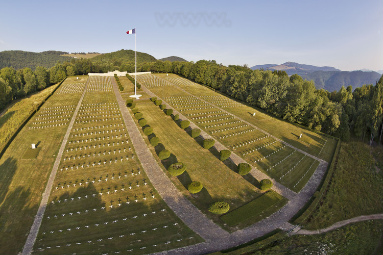 Battle of Hartmanswillerkopf (Hill of the Old Armand) : Cemetery (foreground) and National Monument (in the background), one of four with those of Notre Dame de Lorette, Dormans and Douaumont. It houses a crypt with tombs and 1264 identified bodies and six ossuaries (12,000 unknown soldiers). In the background right, the Grand Ballon des Vosges. Strategic position overlooking the plain of Alsace, about 300,000 men fought here to win (for French) or defend (for German) Alsace region. Approximately 50,000 people were killed in action or missing.
