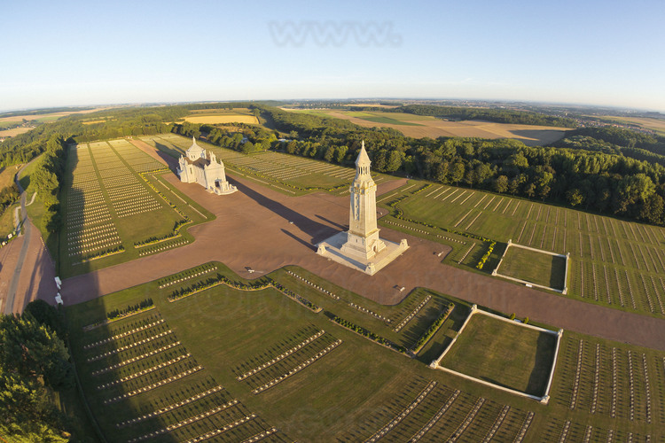 Battle of Artois, hill of Notre Dame de Lorette : National Cemetery (one of the four with those of Dormans, Douaumont and Vieil Armand). This hill overlooking Artois (165 m.) was one of the most fought battlefield between October 1914 and September 1915. After the war, the French government created the board of Notre Dame de Lorette which will be the largest French necropolis : 20,000 individual graves (the cemetery of Douaumont is composed of 16,142 individual graves) are erect and bodies of 22000 other unknown soldiers are grouped into eight ossuaries (two of them in the white square on the right), including the lantern tower (photo 006). From March to November, the dead are watched over daily by the 
