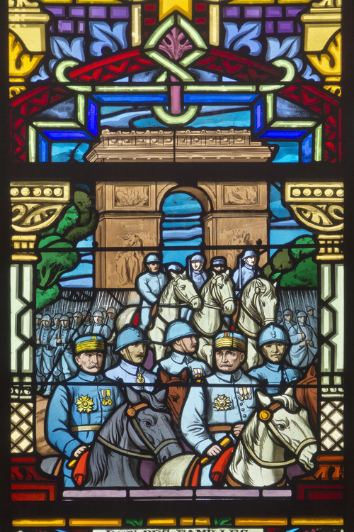 Battle of Artois, hill of Notre Dame de Lorette : Stained glass inside the National Cemetery. (one of the four with those of Dormans, Douaumont and Vieil Armand). This hill overlooking Artois (165 m.) was one of the most fought battlefield between October 1914 and September 1915. After the war, the French government created the board of Notre Dame de Lorette which will be the largest French necropolis : 20,000 individual graves (the cemetery of Douaumont is composed of 16,142 individual graves) are erect and bodies of 22000 other unknown soldiers are grouped into eight ossuaries (two of them in the white square on the right), including the lantern tower (photo 006). From March to November, the dead are watched over daily by the 