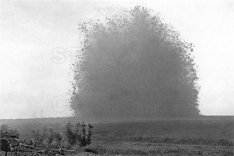 Battle of the Somme : Lochnanar Crater (Big Mine), close to village of La Boiselle. The mine exploded on July 1, 1916 at 7:28 am, marking the beginning of the Battle of the Somme. That day, the men jumped from their positions ignoring they rushed towards imminent death caused by their own camp : for a few minutes before the infantry assault, several huge explosions triggered by the allies and intended to break the German front lines, dug deep craters such as this borehole, which is 100 meters in diameter and 30 meters deep, and currently the only accessible to public. The beginning of the Battle of the Somme was the scene of a terrible carnage : 58000 men killed or wounded in the first day. Four months later, the result is terrible : 1200000 men put out of action for a total of 3000000 men. It was the British, with about 420,000 dead, wounded, missing and prisoners on the only sector of the Somme, who pay the heaviest tribe to slaughter, and 1st July 1916 was the worst day of their entire military history. Every July 1st at 7:28 am, the British hold a ceremony around this crater : in its bottom are deposited thousands of poppies. There are 410 British cemeteries in the Somme. (This historic photo archive is not available for sale and only presented here to set the context).