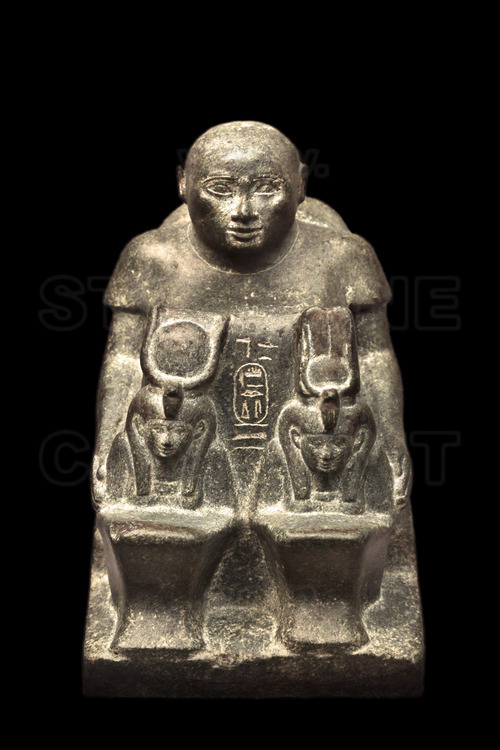 This statuette depicts a senior official, Harwa, with two figures of goddesses. The chief steward of King served in the reign of Amenirdis I during the 25th dynasty (700-670 AD).