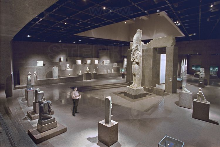 The main hall of the Nubia Museum in Aswan. In the background right, a colossal statue of Ramses II in sandstone, which was originally on the colonnade of the temple Garf Hussein, built by the Viceroy Kushite Setau during the nineteenth dynasty. Such as Abu Simbel, the Temple of Garf Hussein was moved away from the rising waters of Lake Nasser. In the left foreground, the French Egyptologist Jean-Pierre Corteggiani.