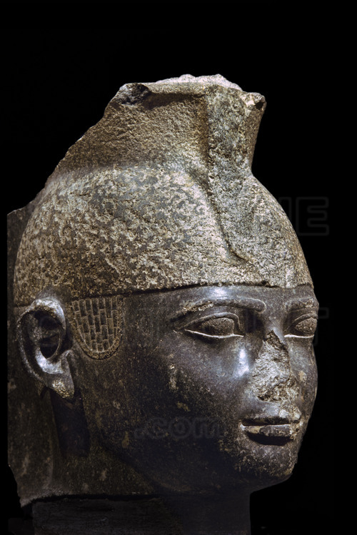This granite head of King Taharta, younger brother of Shabataka, shows him idealized to conform to the Egyptian canons, contrary to his other statues. His stela in the remple of Kawa records his achievments in Nubia and Egypt. 25th dynastie. Discovered in Karnak (Egypt).