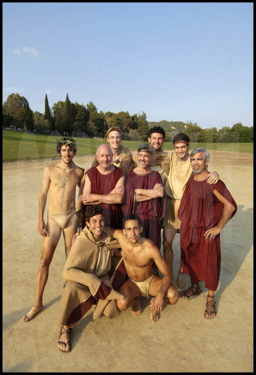 In the ancient stadium of Olympia the entire French delegation standing from left to right:  Christophe Chairiguet, winner of the dolichos competition, Jean-Claude Perrin, Guillaume Barras, winner of the pentathlon, Philippe de Carbonnières, Xavier Iacovelli, Olivier Marchon, winner of the armed race and Georges Ballery.  Sitting, from left to right, Romain Jalabert and Anthony Salomone.