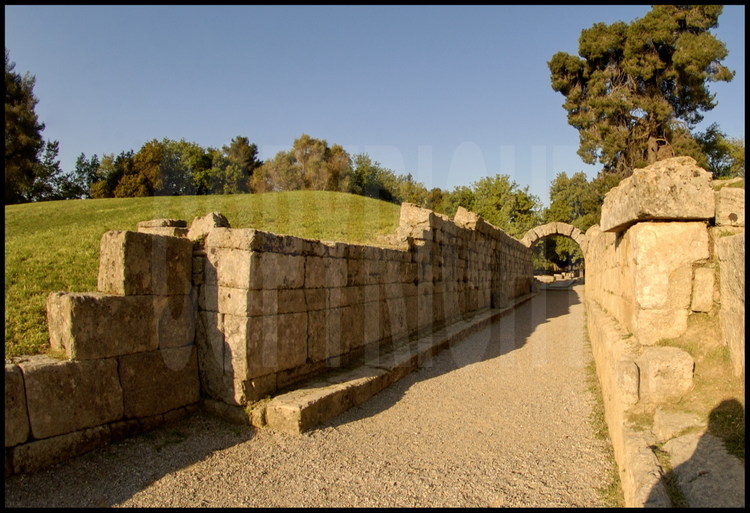 Ancient stadium of Olympia.  The Crypt (tunnel) was entirely covered.  As the only passage way between the sanctuary of the gods and the sports arena, it was exclusively reserved for officials, hellanodices (referees) and athletes.