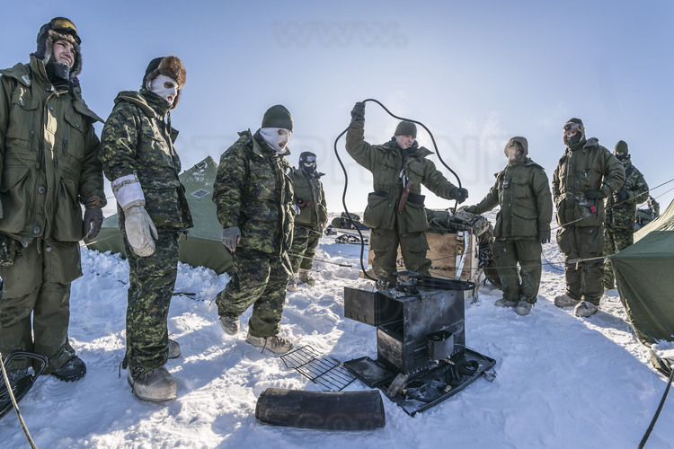 Canada - State of Nunavut - Operation NUNALIVUT 2018 - Surroundings of Cambridge Bay - Arrival at Survival Camp # 1 - Installation of the much needed stoves. To avoid any risk of fire, it will be monitored non-stop, including at night with watchtowers.