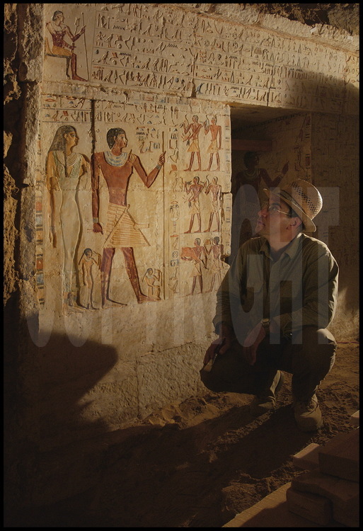 Vassil Dobrev takes down notes as he studies the left wall of the façade, which holds representations of Hau-Nefer and his wife Khuti, as well as their thirteen children. Hau-Nefer was not only a priest in the funerary temple of Pepi I, but was also a high-ranking noble and a high priest. Khuti was a priestess of Hathor.