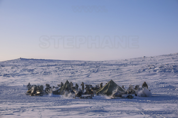 Canada - State of Nunavut - Operation NUNALIVUT 2018 - Surroundings of Cambridge Bay - Early morning survival camp # 1: Snowmobiles are started every day to ensure they run smoothly in an emergency.