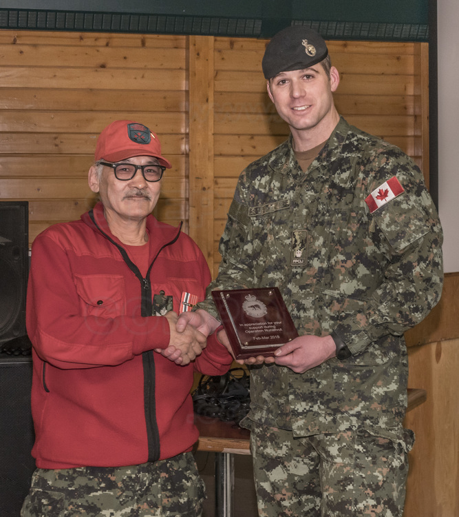 Canada - State of Nunavut - Operation Nunalivut 2018 - Village of Cambridge Bay (1700 inhabitants), the main community on the Northwest Passage. Community Day allows the military to meet the villagers and explain the operation and their presence in the area. Operation presentation by Jimmy Evalik, 59, Ranger Chief of the Cambridge Bay Area (left) and Major Christopher Hartwick, 35, Operation NUNALIVUT 2018 (right).