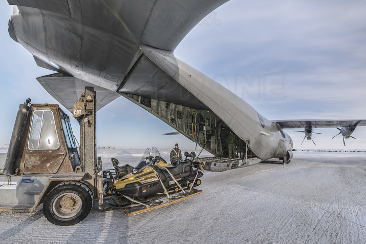 Canada - State of Nunavut - Operation NUNALIVUT 2018 - Military Flight from Halifax, Nova Scotia to Cambridge Bay, Nunavut - Disembarkation of snowmobiles from Hercules C130 aircraft at Cambridge Bay aerodrome.